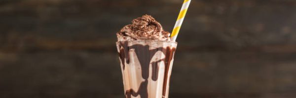 Chocolate Milk and Whipped Cream on Table